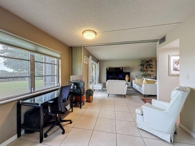 This charming 2-bed, 2-bath home features tile floors, neutral on Hollybrook Golf and Tennis Club  in Florida - for sale on GolfHomes.com, golf home, golf lot