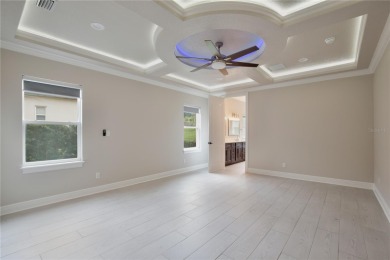 Discover the epitome of elegance and comfort in this on Kings Ridge Golf Club in Florida - for sale on GolfHomes.com, golf home, golf lot