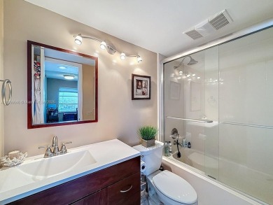 This charming 2-bed, 2-bath home features tile floors, neutral on Hollybrook Golf and Tennis Club  in Florida - for sale on GolfHomes.com, golf home, golf lot