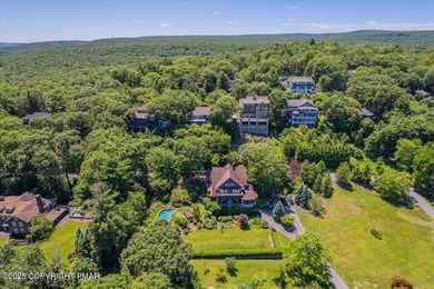 Mountain and golf course views make this light filled open floor on Buck Hill Golf Club  in Pennsylvania - for sale on GolfHomes.com, golf home, golf lot