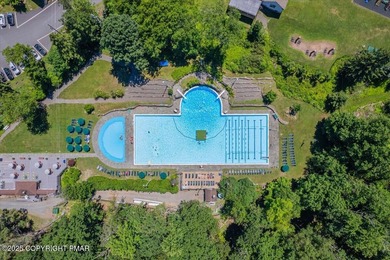 Mountain and golf course views make this light filled open floor on Buck Hill Golf Club  in Pennsylvania - for sale on GolfHomes.com, golf home, golf lot
