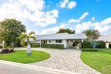 Welcome home to this charming 2-bedroom, 2-bath single-family on Atlantis Golf Club in Florida - for sale on GolfHomes.com, golf home, golf lot