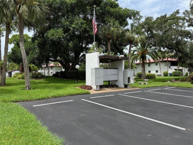 Welcome to your slice of paradise in this first-floor 2-bedroom on IMG Academies Golf and Country Club in Florida - for sale on GolfHomes.com, golf home, golf lot