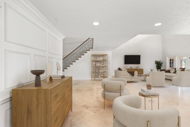 Enjoy lakefront sunsets from this elegant home in the gated on Greenview Cove Golf Club in Florida - for sale on GolfHomes.com, golf home, golf lot