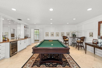 Enjoy lakefront sunsets from this elegant home in the gated on Greenview Cove Golf Club in Florida - for sale on GolfHomes.com, golf home, golf lot