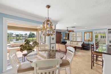 Enjoy lakefront sunsets from this elegant home in the gated on Greenview Cove Golf Club in Florida - for sale on GolfHomes.com, golf home, golf lot