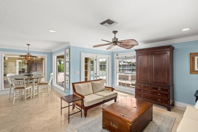 Enjoy lakefront sunsets from this elegant home in the gated on Greenview Cove Golf Club in Florida - for sale on GolfHomes.com, golf home, golf lot