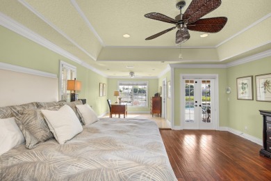 Enjoy lakefront sunsets from this elegant home in the gated on Greenview Cove Golf Club in Florida - for sale on GolfHomes.com, golf home, golf lot