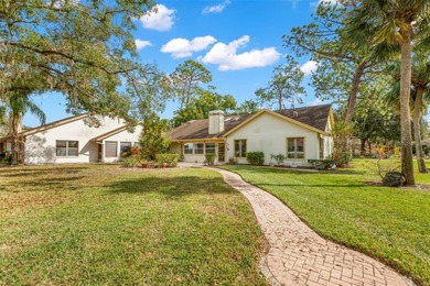 Spaciousness and privacy!  Welcome home to your 3 bedroom, 2.5 on Tarpon Woods Golf Club in Florida - for sale on GolfHomes.com, golf home, golf lot