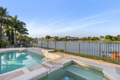 Enjoy lakefront sunsets from this elegant home in the gated on Greenview Cove Golf Club in Florida - for sale on GolfHomes.com, golf home, golf lot