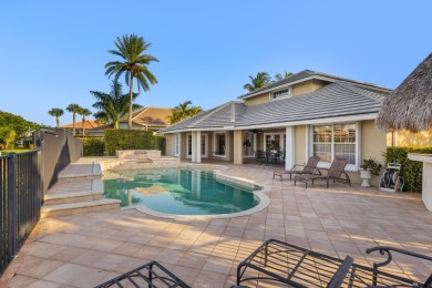 Enjoy lakefront sunsets from this elegant home in the gated on Greenview Cove Golf Club in Florida - for sale on GolfHomes.com, golf home, golf lot