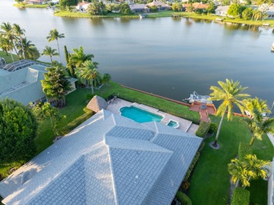 Enjoy lakefront sunsets from this elegant home in the gated on Greenview Cove Golf Club in Florida - for sale on GolfHomes.com, golf home, golf lot