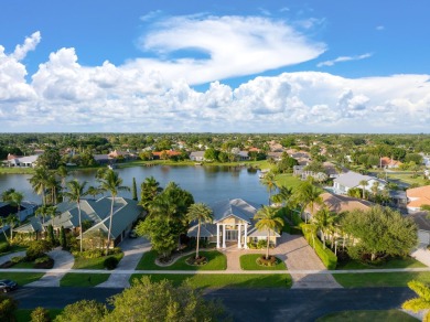 Enjoy lakefront sunsets from this elegant home in the gated on Greenview Cove Golf Club in Florida - for sale on GolfHomes.com, golf home, golf lot
