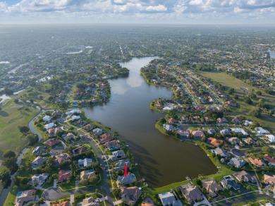 Enjoy lakefront sunsets from this elegant home in the gated on Greenview Cove Golf Club in Florida - for sale on GolfHomes.com, golf home, golf lot