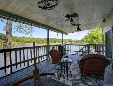 Discover your dream home that boasts breathtaking lake and golf on Diamondhead Golf and Country Club in Arkansas - for sale on GolfHomes.com, golf home, golf lot
