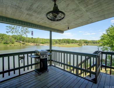 Discover your dream home that boasts breathtaking lake and golf on Diamondhead Golf and Country Club in Arkansas - for sale on GolfHomes.com, golf home, golf lot