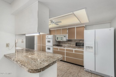 Welcome to this delightful home situated on a quiet, tree-lined on PalmBrook Country Club in Arizona - for sale on GolfHomes.com, golf home, golf lot