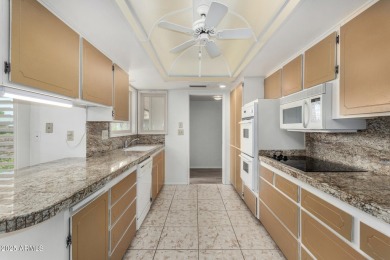 Welcome to this delightful home situated on a quiet, tree-lined on PalmBrook Country Club in Arizona - for sale on GolfHomes.com, golf home, golf lot