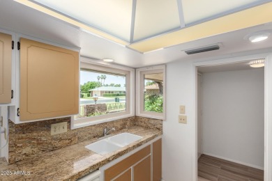 Welcome to this delightful home situated on a quiet, tree-lined on PalmBrook Country Club in Arizona - for sale on GolfHomes.com, golf home, golf lot