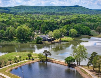 Discover your dream home that boasts breathtaking lake and golf on Diamondhead Golf and Country Club in Arkansas - for sale on GolfHomes.com, golf home, golf lot