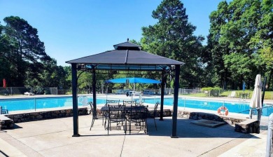 Discover your dream home that boasts breathtaking lake and golf on Diamondhead Golf and Country Club in Arkansas - for sale on GolfHomes.com, golf home, golf lot