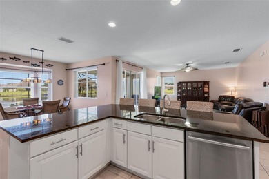 Waterfront home with a private saltwater pool & spa and 3-car on Oaks National Golf Course in Florida - for sale on GolfHomes.com, golf home, golf lot