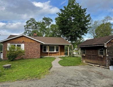 Lakeside living at its finest! Enjoy easy, one-level living in on Lake Lackawanna Golf Course in New Jersey - for sale on GolfHomes.com, golf home, golf lot