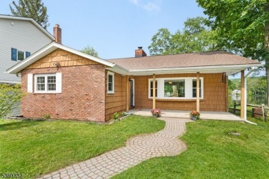 Lakeside living at its finest! Enjoy easy, one-level living in on Lake Lackawanna Golf Course in New Jersey - for sale on GolfHomes.com, golf home, golf lot