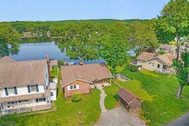 Lakeside living at its finest! Enjoy easy, one-level living in on Lake Lackawanna Golf Course in New Jersey - for sale on GolfHomes.com, golf home, golf lot