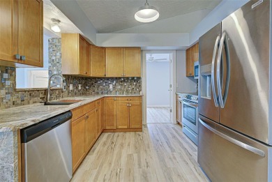 Welcome to this beautifully updated home featuring 3 bedrooms on Jacaranda West Country Club in Florida - for sale on GolfHomes.com, golf home, golf lot