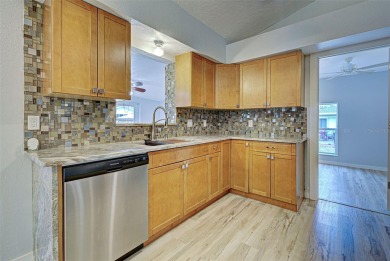 Welcome to this beautifully updated home featuring 3 bedrooms on Jacaranda West Country Club in Florida - for sale on GolfHomes.com, golf home, golf lot