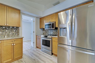 Welcome to this beautifully updated home featuring 3 bedrooms on Jacaranda West Country Club in Florida - for sale on GolfHomes.com, golf home, golf lot