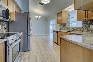 Welcome to this beautifully updated home featuring 3 bedrooms on Jacaranda West Country Club in Florida - for sale on GolfHomes.com, golf home, golf lot