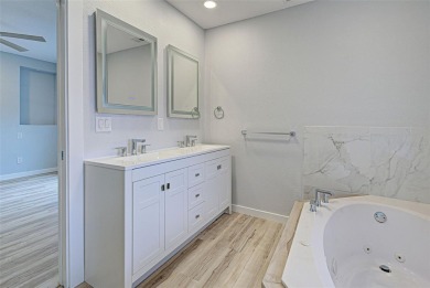 Welcome to this beautifully updated home featuring 3 bedrooms on Jacaranda West Country Club in Florida - for sale on GolfHomes.com, golf home, golf lot
