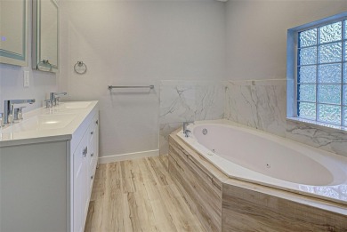 Welcome to this beautifully updated home featuring 3 bedrooms on Jacaranda West Country Club in Florida - for sale on GolfHomes.com, golf home, golf lot