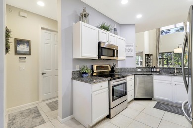 ENJOY GOLF VIEWS FROM THIS NICELY UPDATED TOWNHOUSE IN THE on The Legacy Golf and Tennis Club in Florida - for sale on GolfHomes.com, golf home, golf lot