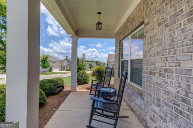 Located in the highly sought-after Traditions of Braselton, this on Traditions of Braselton Golf Club in Georgia - for sale on GolfHomes.com, golf home, golf lot