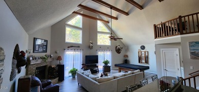 A must-see home in Lake Royale. This beautiful A Frame home on River Golf and Country Club at Lake Royale in North Carolina - for sale on GolfHomes.com, golf home, golf lot