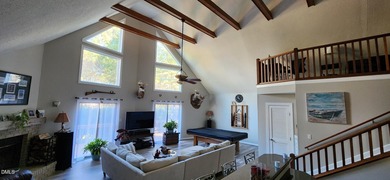 A must-see home in Lake Royale. This beautiful A Frame home on River Golf and Country Club at Lake Royale in North Carolina - for sale on GolfHomes.com, golf home, golf lot