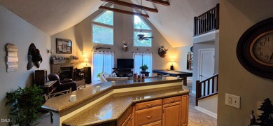 A must-see home in Lake Royale. This beautiful A Frame home on River Golf and Country Club at Lake Royale in North Carolina - for sale on GolfHomes.com, golf home, golf lot