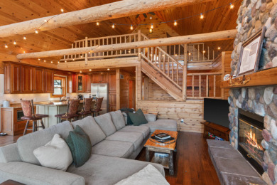 Lakefront Log Home – Private Beach & Docks on Lake Camelot on Sand Valley Golf Course in Wisconsin - for sale on GolfHomes.com, golf home, golf lot