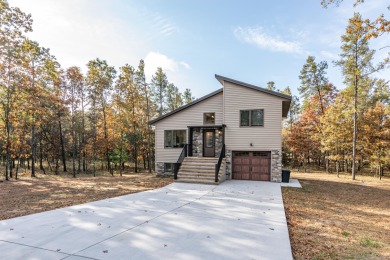 Discover the perfect blend of comfort and recreation in this on Lake Arrowhead Golf Course - The Pines in Wisconsin - for sale on GolfHomes.com, golf home, golf lot