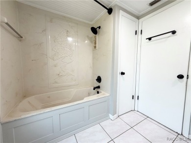 Unlock the potential in this nearly finished 4-bedroom, 2.5-bath on Citrus Springs Country Club in Florida - for sale on GolfHomes.com, golf home, golf lot