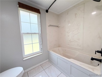 Unlock the potential in this nearly finished 4-bedroom, 2.5-bath on Citrus Springs Country Club in Florida - for sale on GolfHomes.com, golf home, golf lot