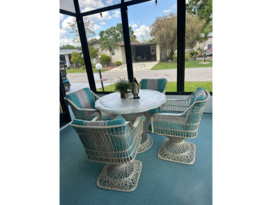 Discover this adorable and meticulously cared-for 2-bedroom home on Schalamar Creek Golf and Country Club in Florida - for sale on GolfHomes.com, golf home, golf lot
