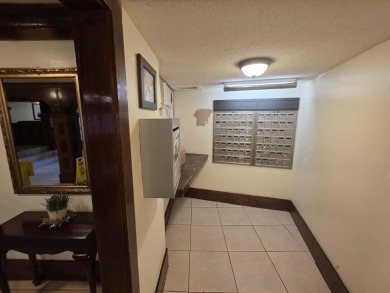 Nestled in a highly desirable International Village community on Inverrary Country Club in Florida - for sale on GolfHomes.com, golf home, golf lot