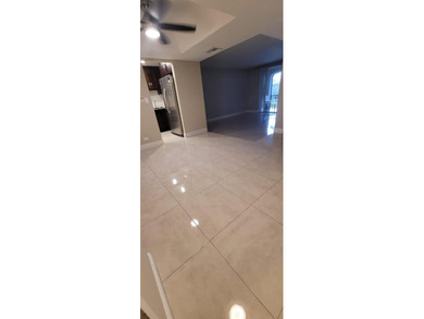 Nestled in a highly desirable International Village community on Inverrary Country Club in Florida - for sale on GolfHomes.com, golf home, golf lot