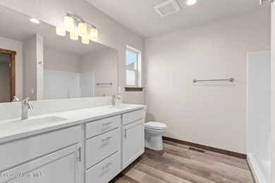 This brand new single-level home is located in a neighborhood on Prairie Falls Golf Club in Idaho - for sale on GolfHomes.com, golf home, golf lot