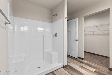 This brand new single-level home is located in a neighborhood on Prairie Falls Golf Club in Idaho - for sale on GolfHomes.com, golf home, golf lot