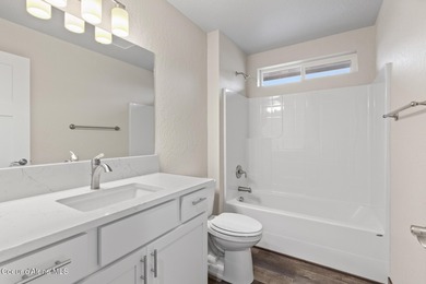 This brand new single-level home is located in a neighborhood on Prairie Falls Golf Club in Idaho - for sale on GolfHomes.com, golf home, golf lot